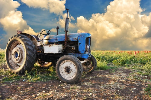 Very old tractor in field, different parts - no trademark at all-1